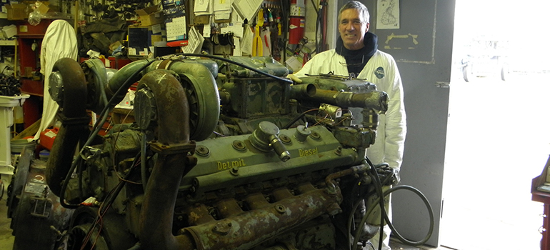 Cedar Island's service department working on a large boat motor